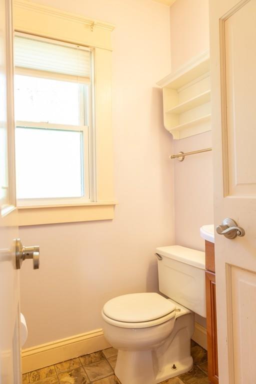 116 Jenness Street Springfield, MA 01104 - Photo 18 of 42 a white toilet sitting next to a window