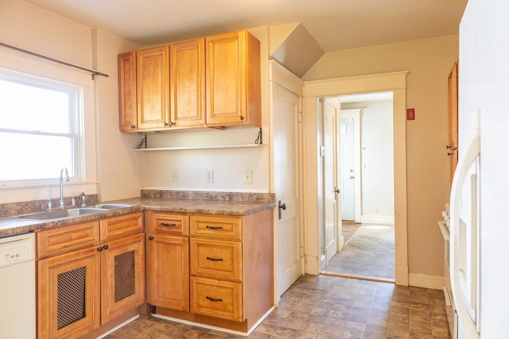 116 Jenness Street Springfield, MA 01104 - Photo 2 of 42 a kitchen with stainless steel appliances granite countertop a refrigerator and a stove