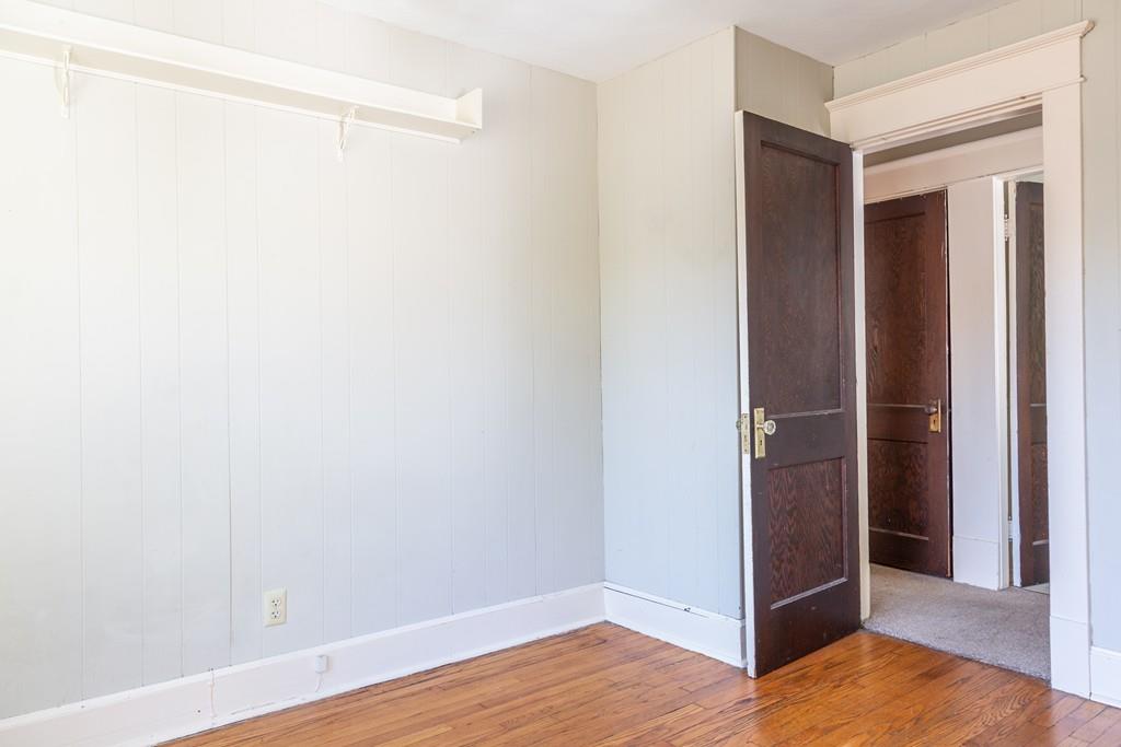 116 Jenness Street Springfield, MA 01104 - Photo 21 of 42 a view of an empty room with wooden floor