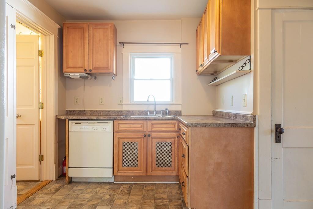 116 Jenness Street Springfield, MA 01104 - Photo 3 of 42 a bathroom with a granite countertop sink and a mirror