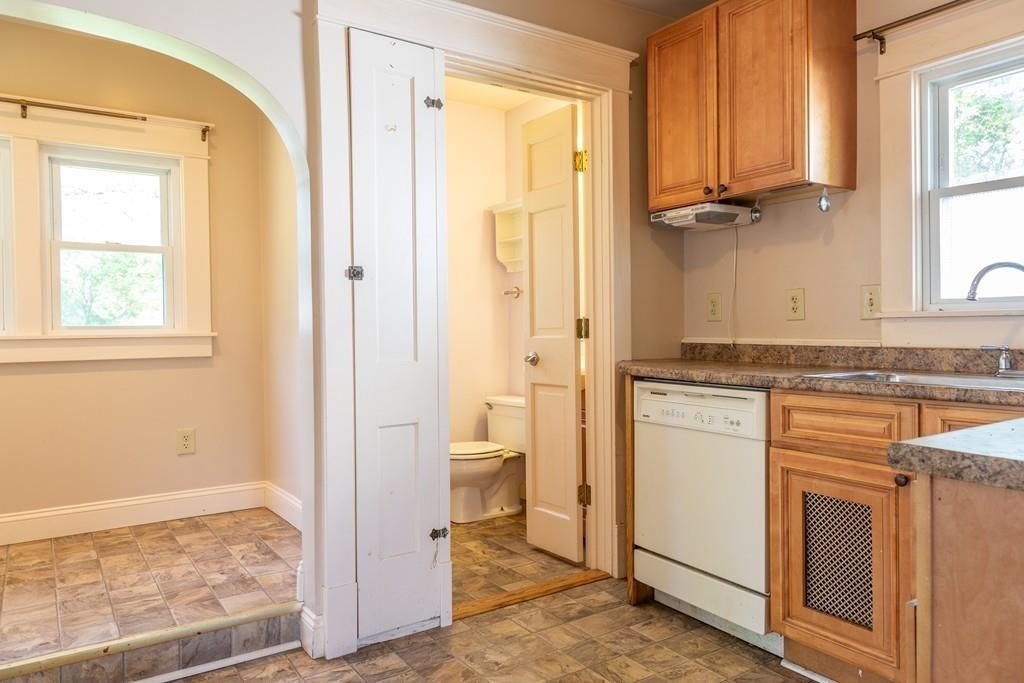 116 Jenness Street Springfield, MA 01104 - Photo 7 of 42 a bathroom with a granite countertop sink and a mirror