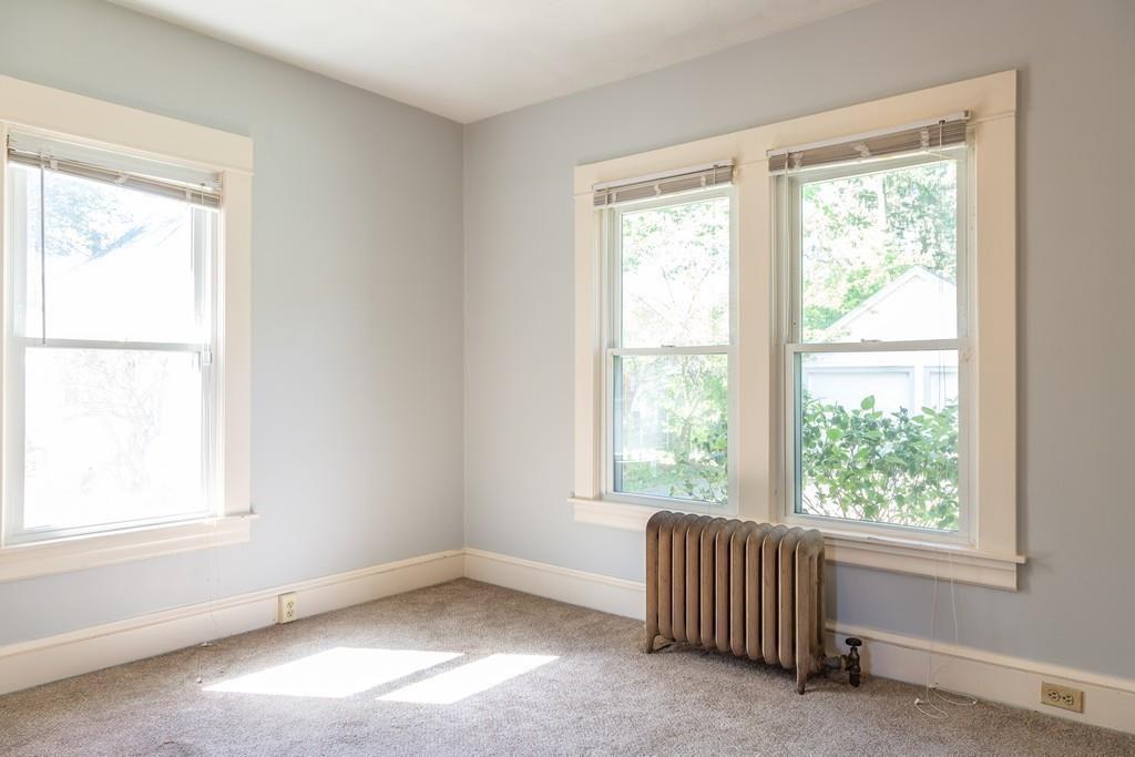 116 Jenness Street Springfield, MA 01104 - Photo 10 of 42 a room with a window and a chair
