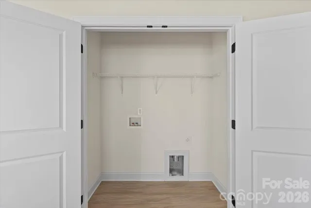 a view of a house with snow on the road