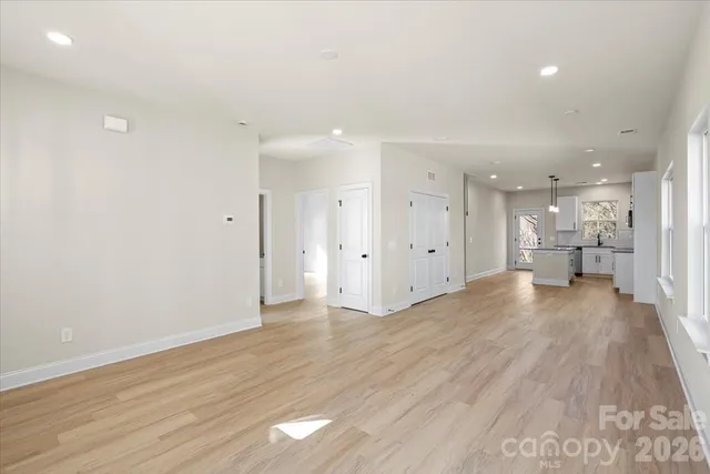 a view of a kitchen with wooden floor