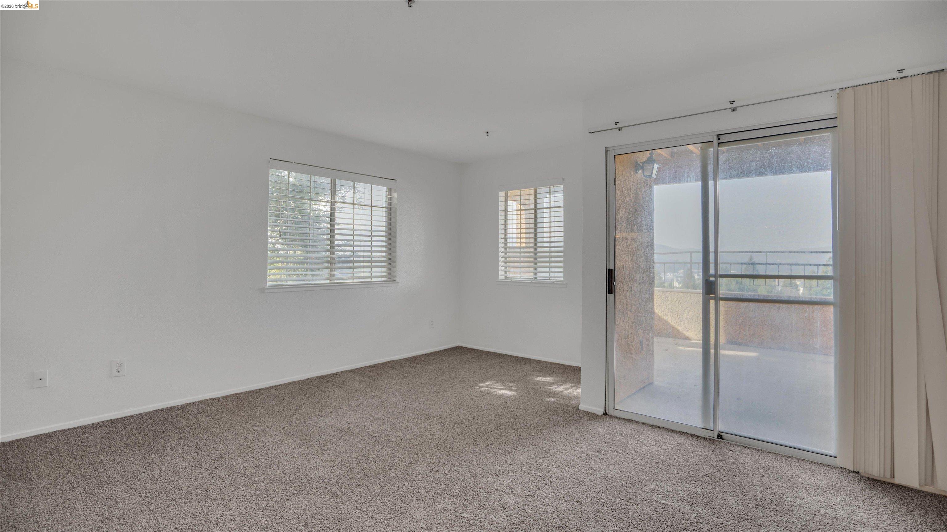 735 Watson Canyon Court, Unit 118 San Ramon, CA 94582 - Photo 13 of 38 an empty room with windows
