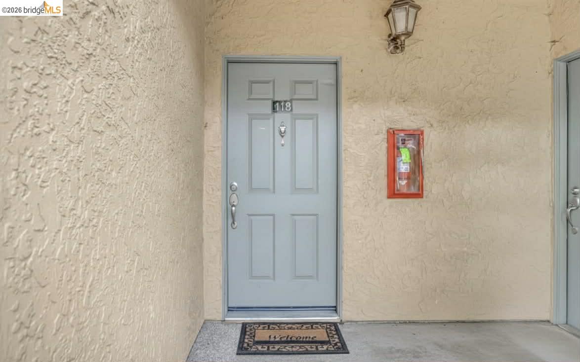 735 Watson Canyon Court, Unit 118 San Ramon, CA 94582 - Photo 2 of 38 a view of a hallway with a elevator