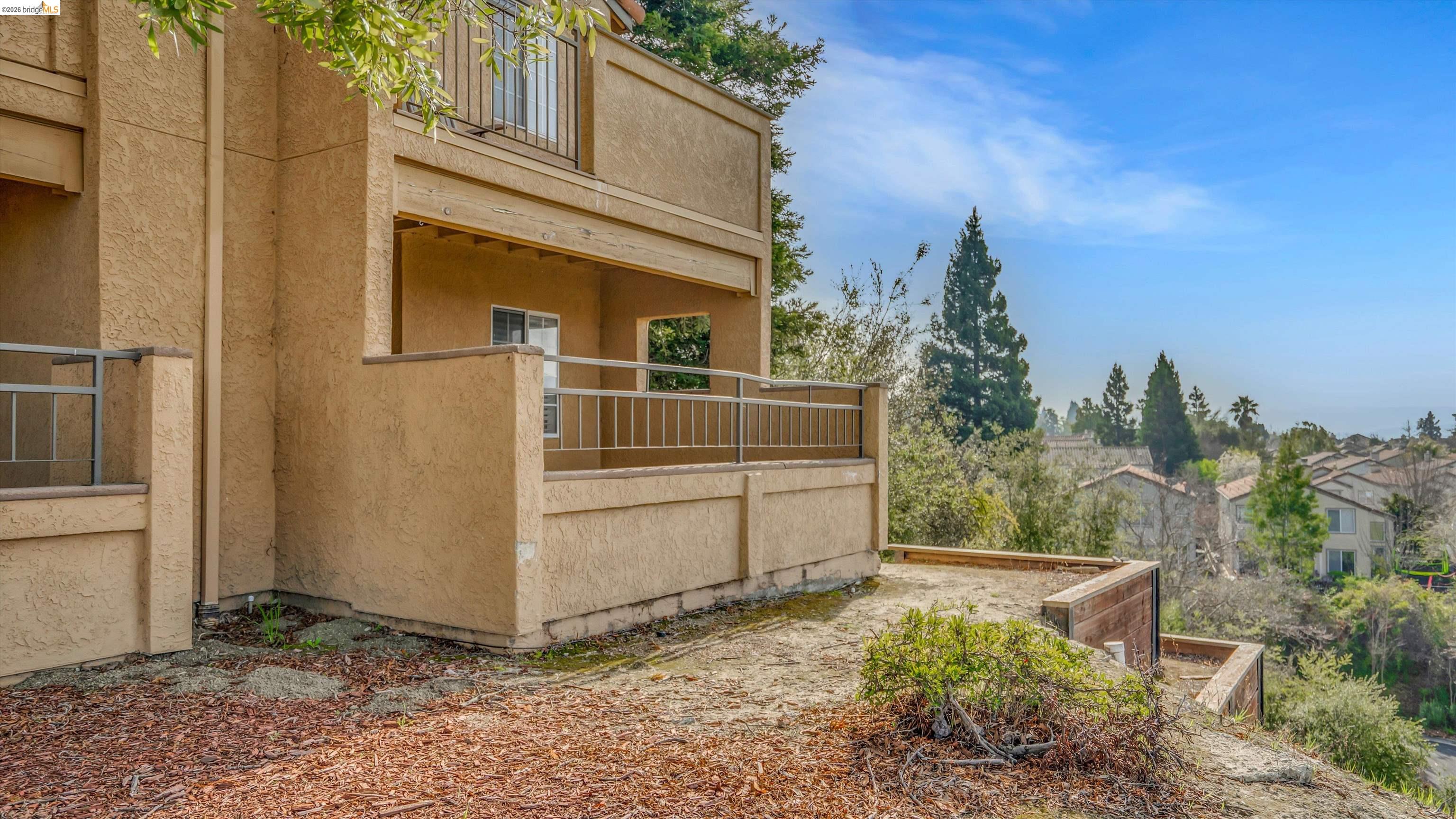 735 Watson Canyon Court, Unit 118 San Ramon, CA 94582 - Photo 21 of 38 a view of a house with a yard
