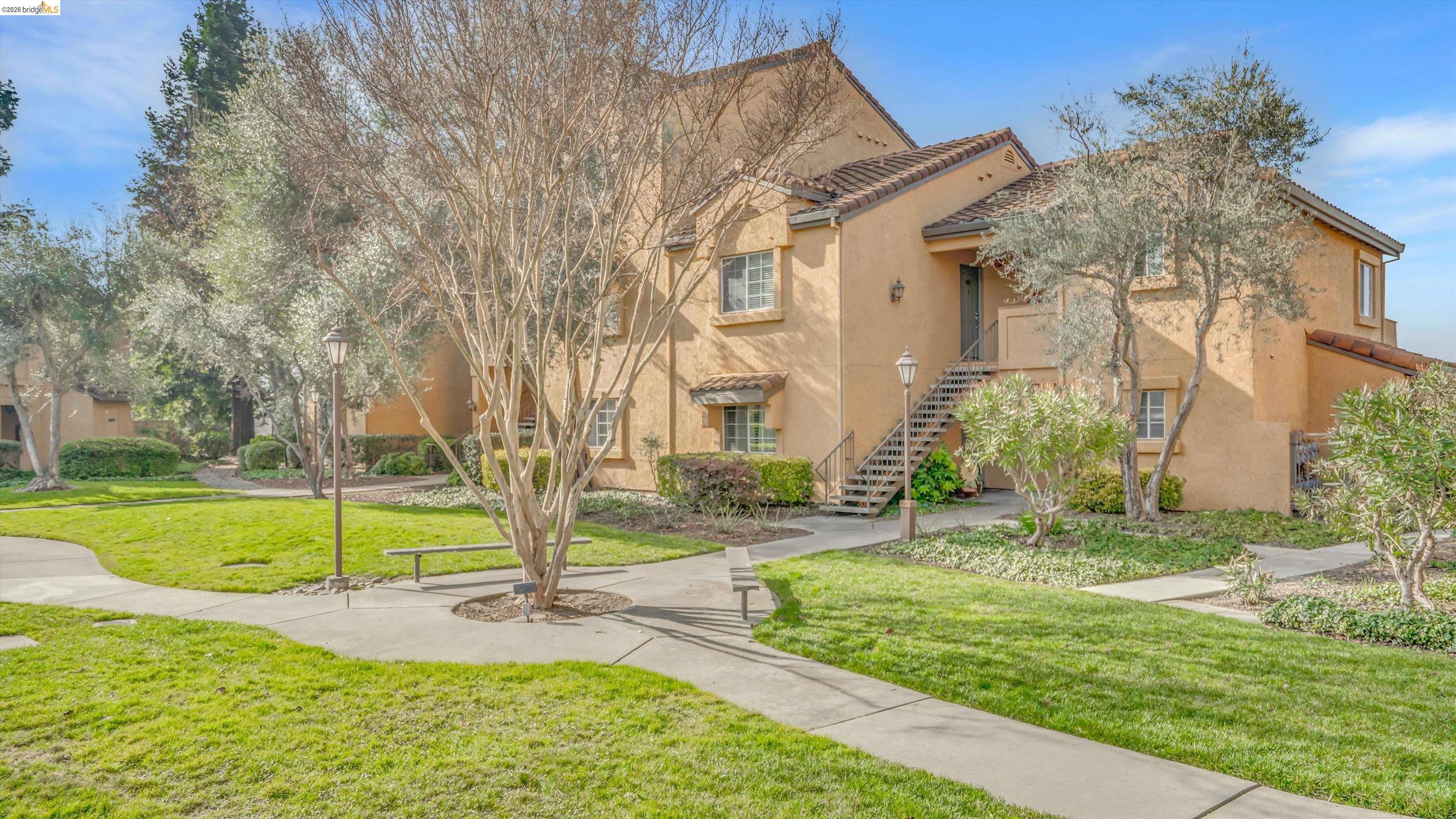 735 Watson Canyon Court, Unit 118 San Ramon, CA 94582 - Photo 26 of 38 a view of a house with a yard and tree s