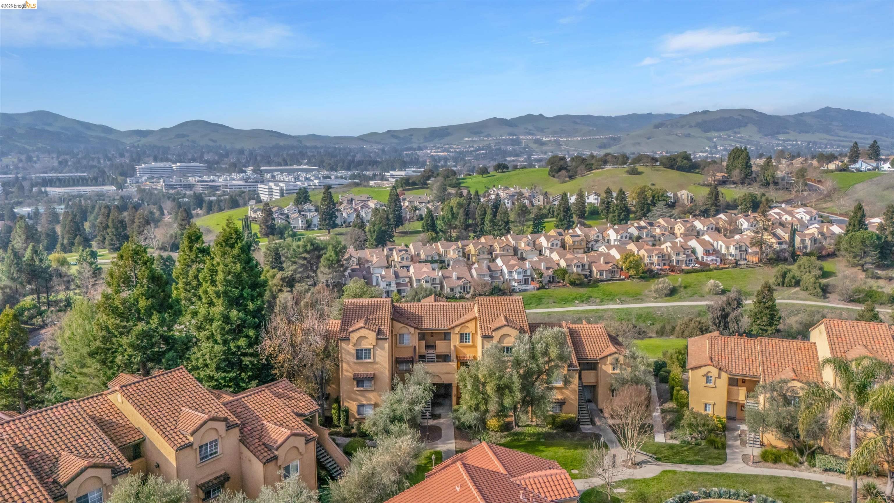 735 Watson Canyon Court, Unit 118 San Ramon, CA 94582 - Photo 30 of 38 an aerial view of a city with lots of residential buildings ocean and mountain view in back