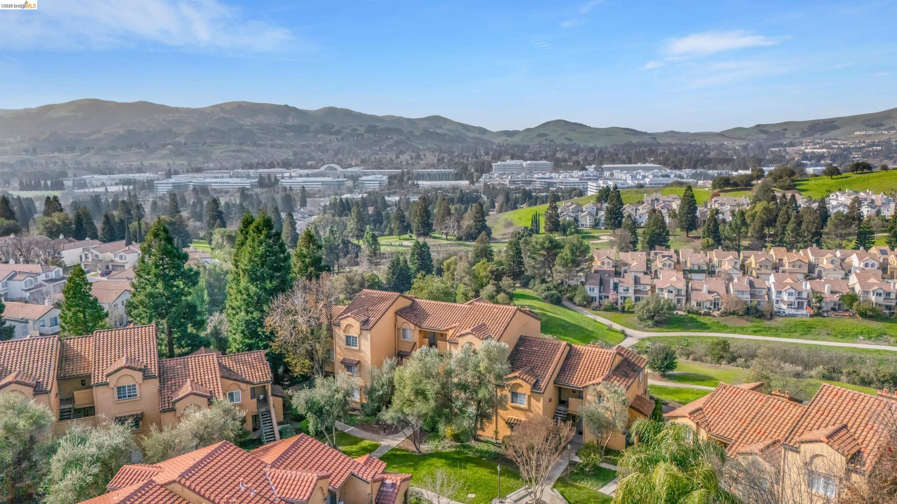 735 Watson Canyon Court, Unit 118 San Ramon, CA 94582 - Photo 33 of 38 an aerial view of green landscape with trees houses and mountain view