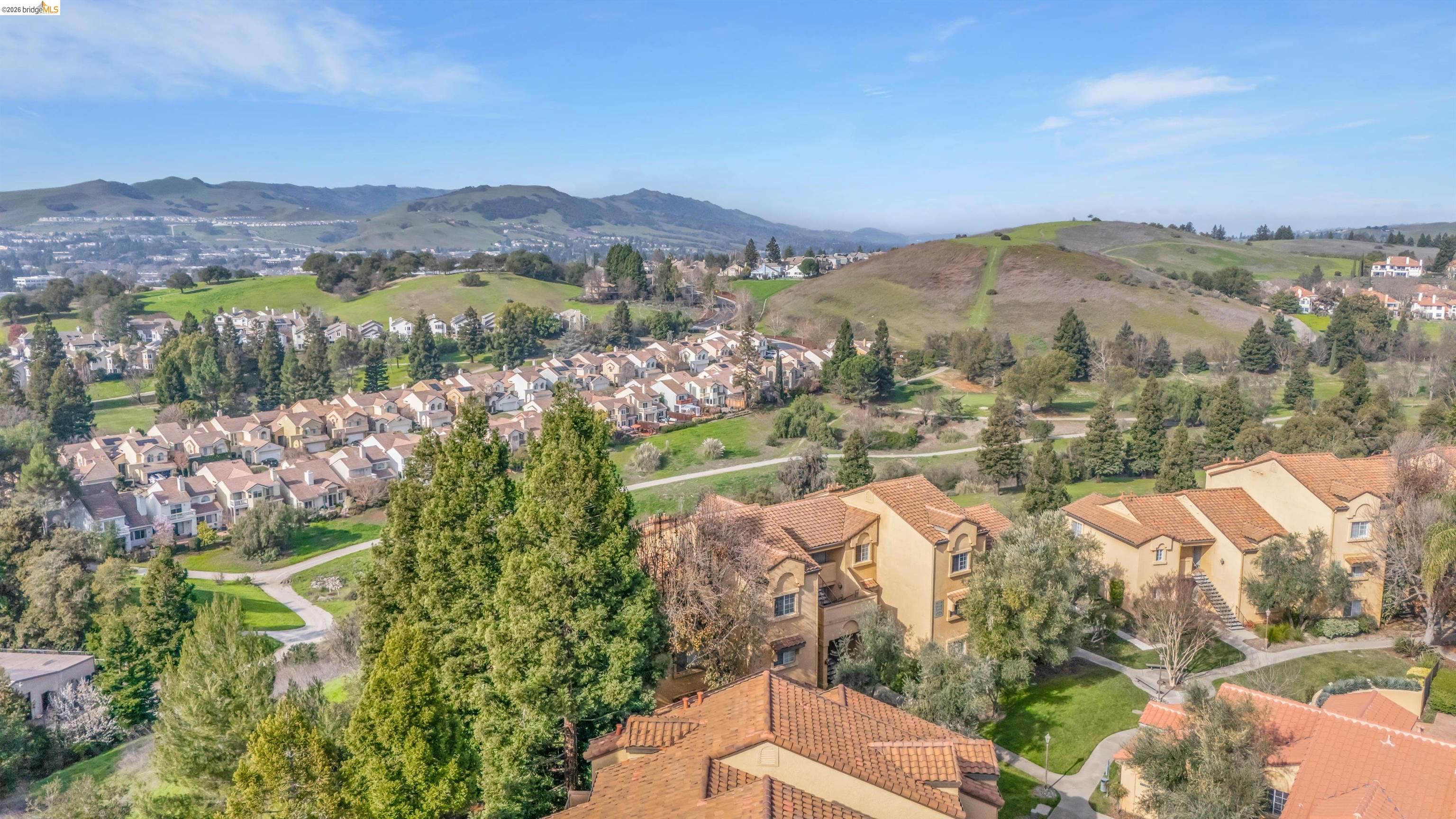 735 Watson Canyon Court, Unit 118 San Ramon, CA 94582 - Photo 34 of 38 a view of a city with mountains in the background