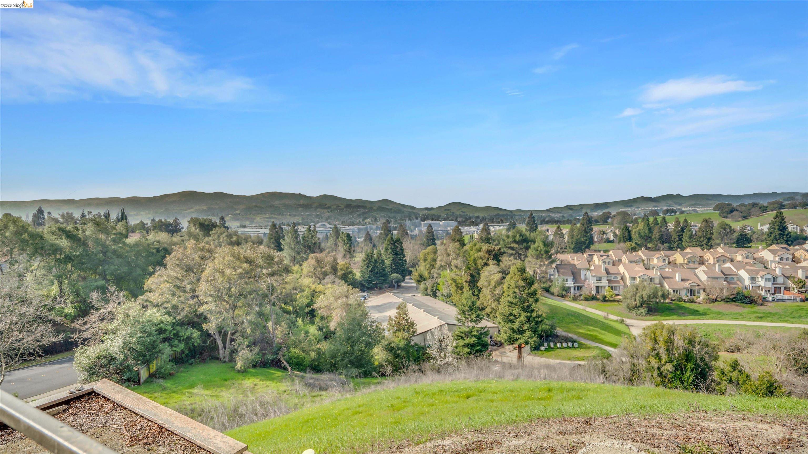 735 Watson Canyon Court, Unit 118 San Ramon, CA 94582 - Photo 35 of 38 a view of a city with lush green forest