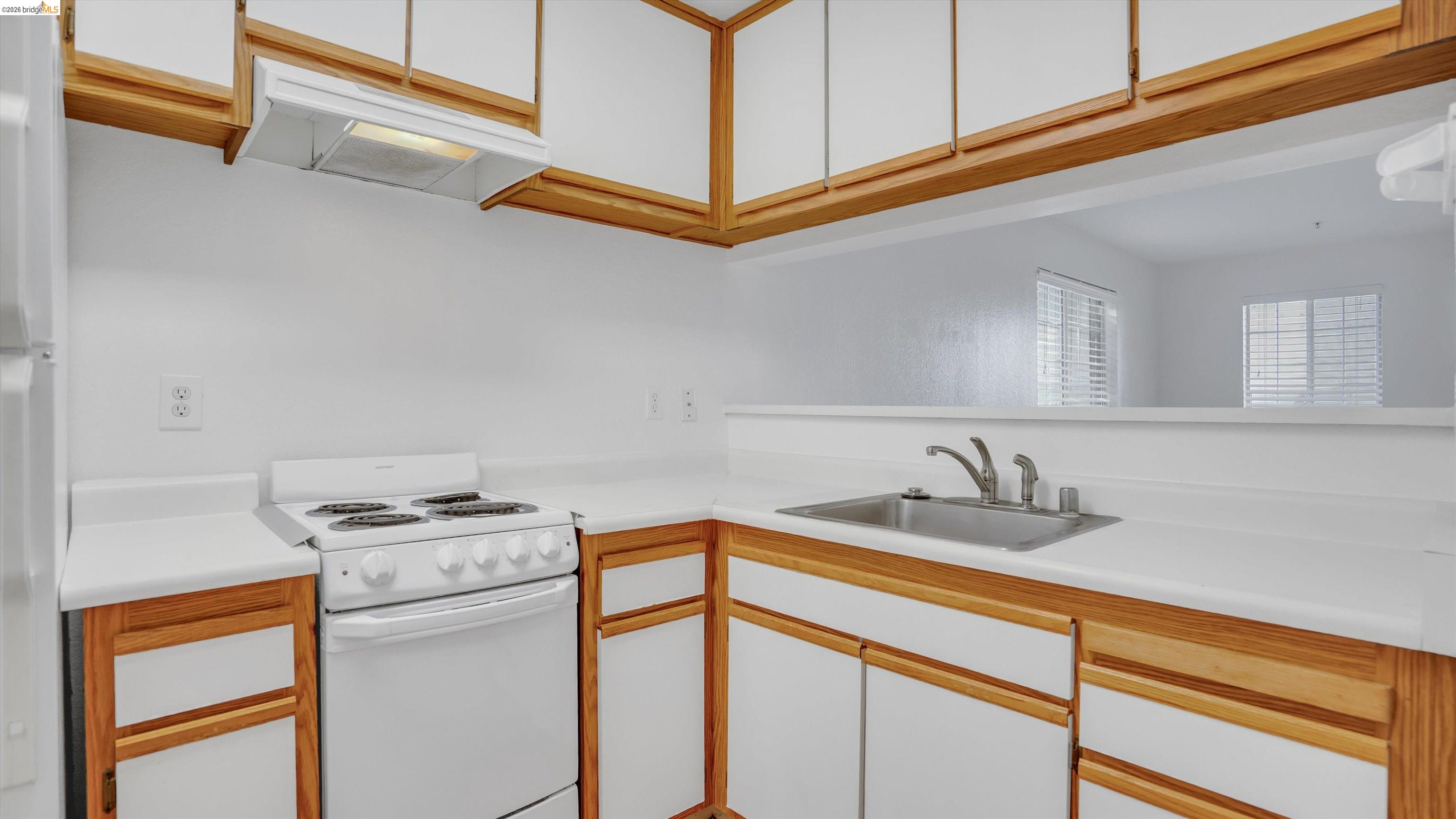 735 Watson Canyon Court, Unit 118 San Ramon, CA 94582 - Photo 6 of 38 a kitchen with a sink cabinets and appliances