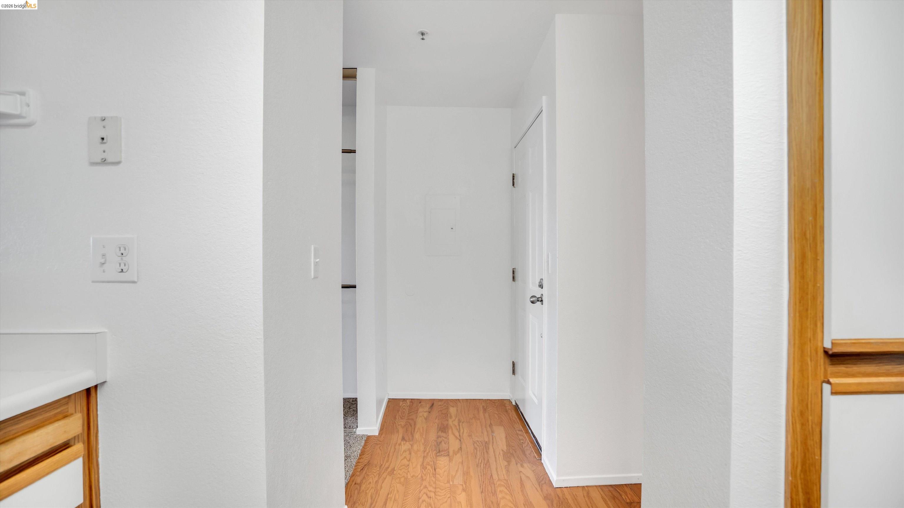 735 Watson Canyon Court, Unit 118 San Ramon, CA 94582 - Photo 8 of 38 a view of a hallway with wooden floor