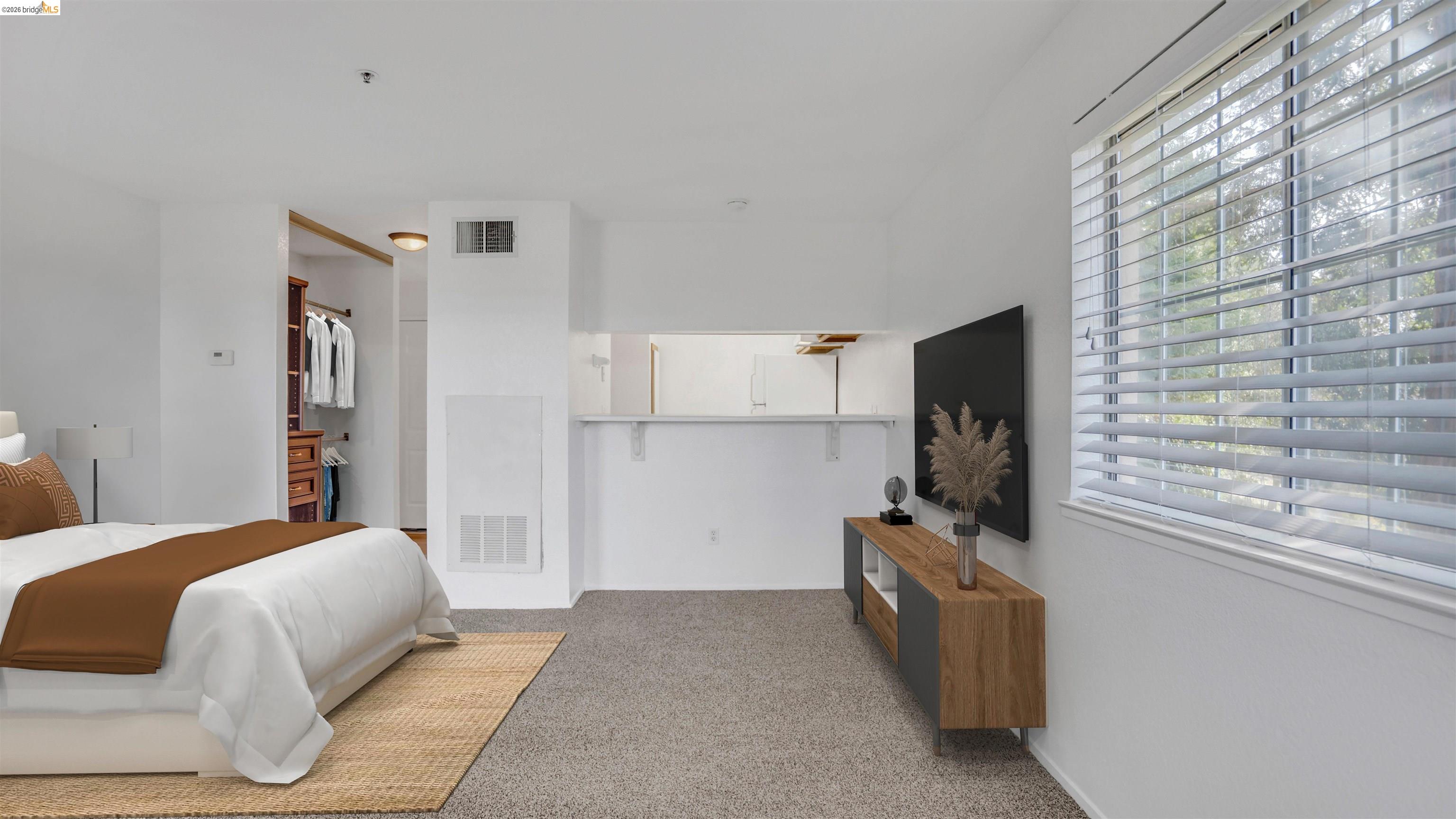 735 Watson Canyon Court, Unit 118 San Ramon, CA 94582 - Photo 10 of 38 a bedroom with a bed flat screen tv and a window