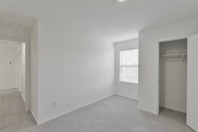 a view of a bathroom from a hallway