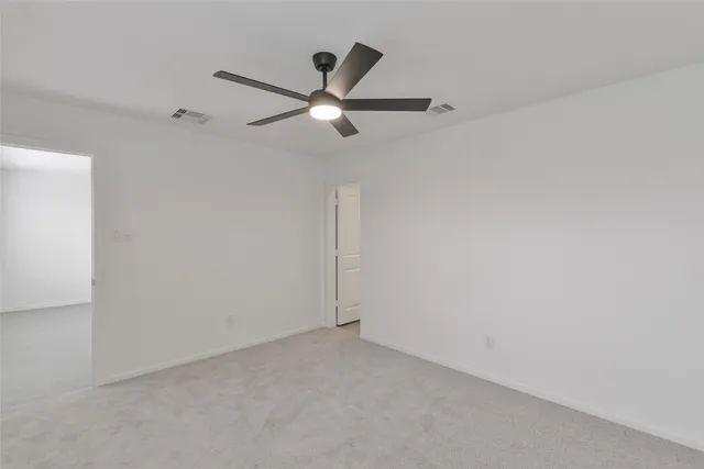 a bathroom with a shower a toilet and a sink