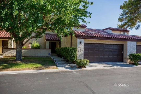 415 Tepatitlan Court Ridgecrest, CA 93555 - Photo 2 of 33 a front view of a house with garden