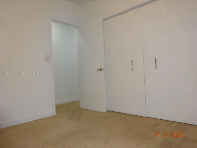 a bedroom with a bed and wall painting