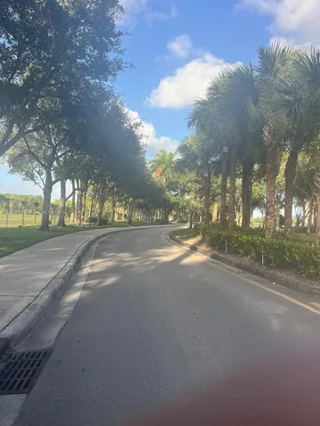 a view of road with green space