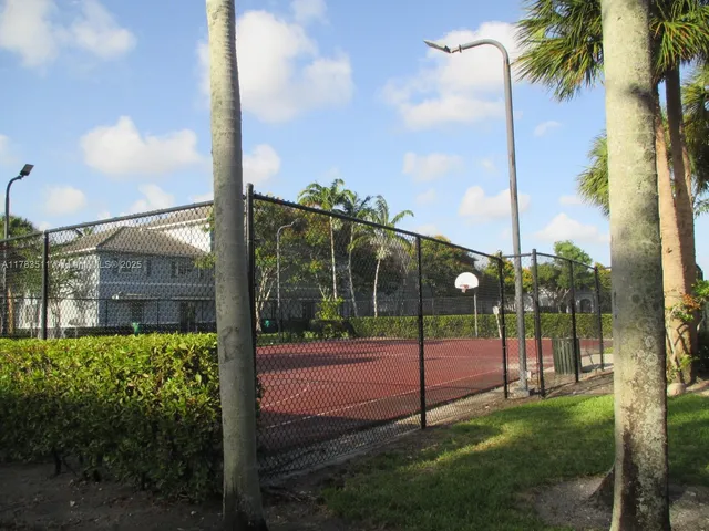 a view of a chair and tables in the patio