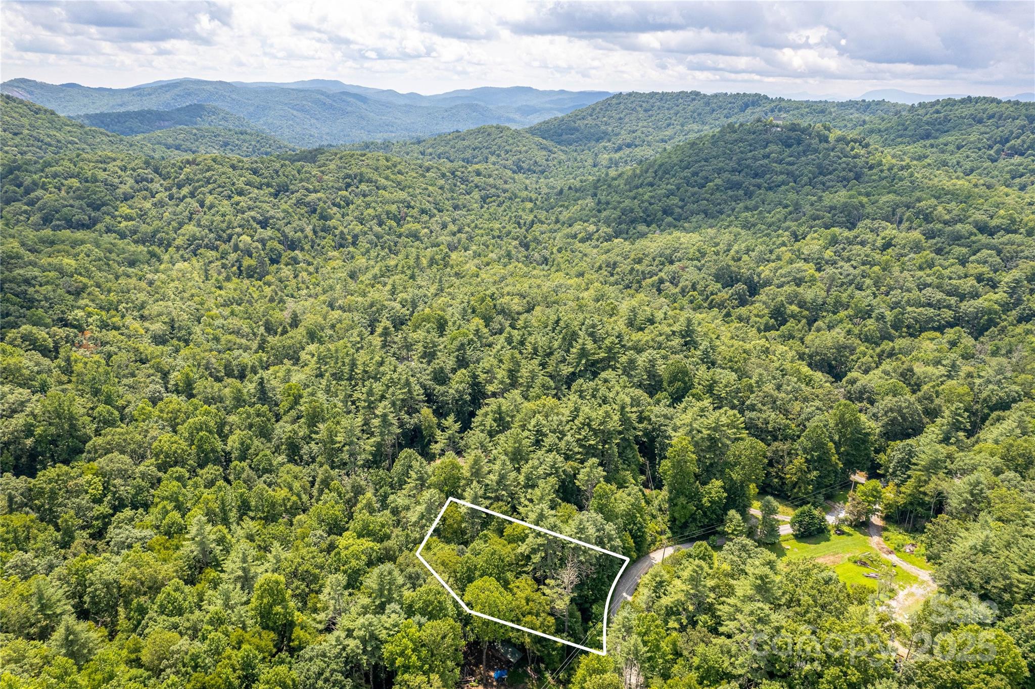 0 Happy Acres Road Brevard, NC 28712 - Photo 15 of 23 a view of a lush green hillside and a houses