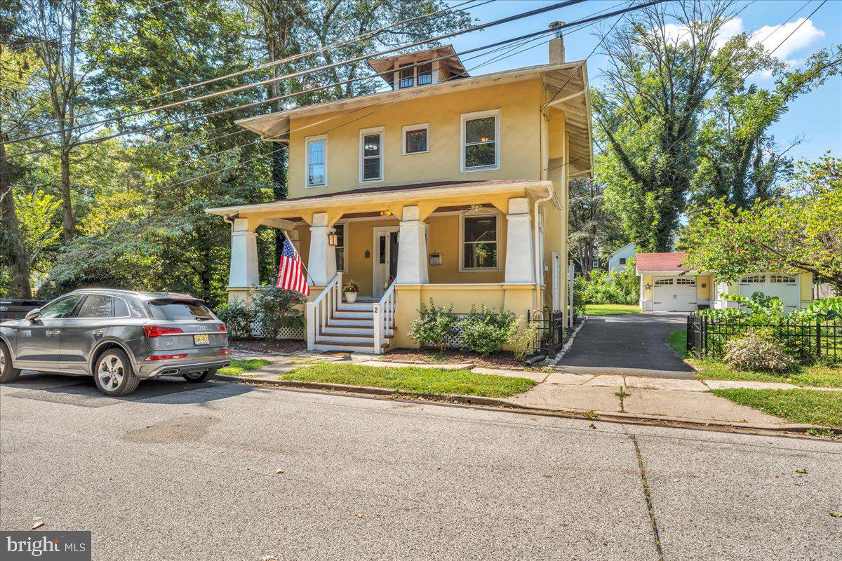 a view of parking space in front of a house