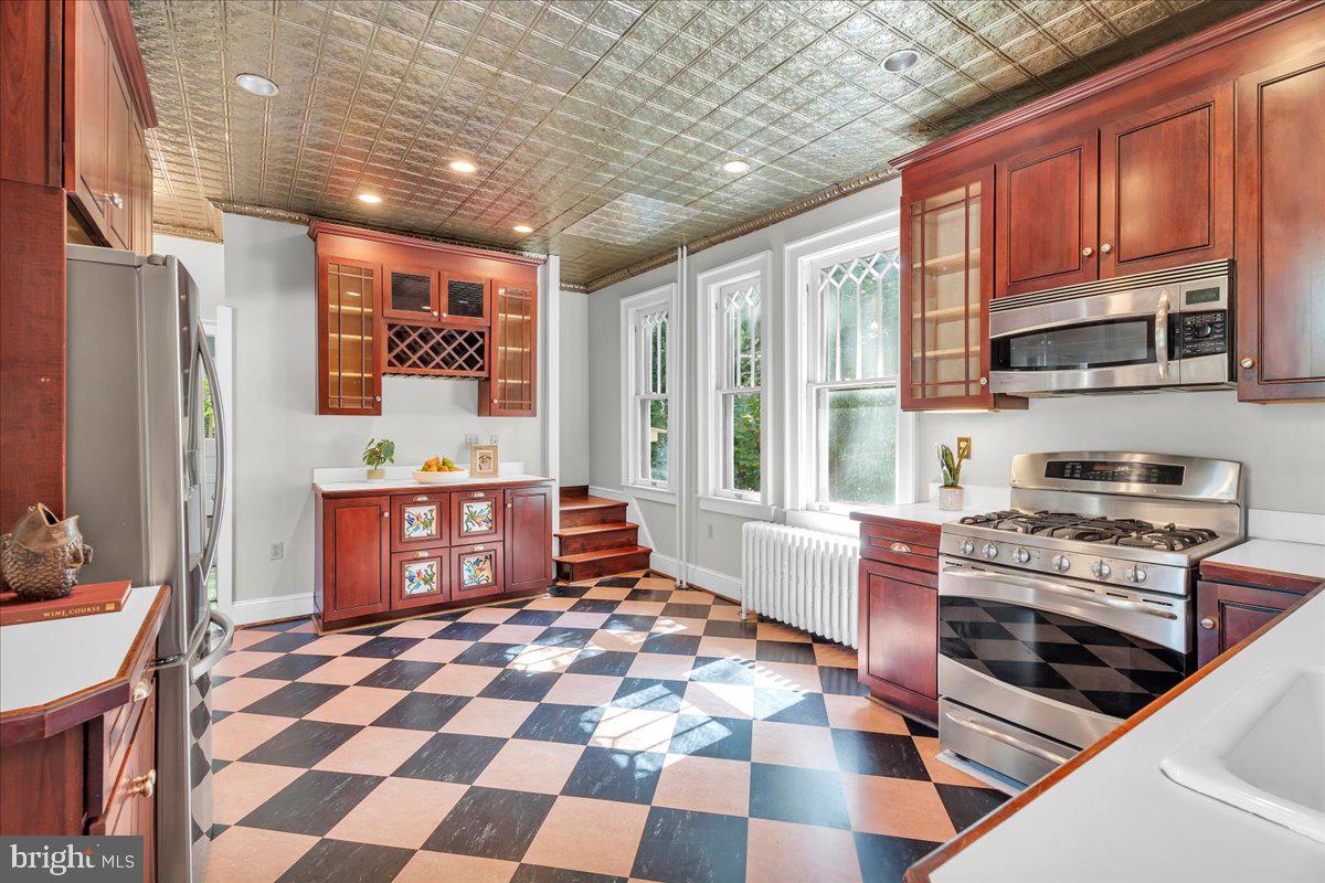2 Evergreen Lane Haddonfield, NJ 08033 - Photo 11 of 25 a kitchen with stainless steel appliances granite countertop a stove a sink and a microwave