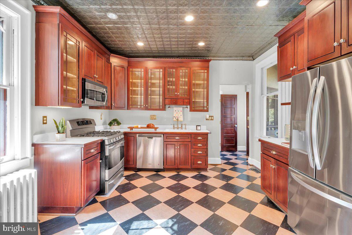 2 Evergreen Lane Haddonfield, NJ 08033 - Photo 12 of 25 a kitchen with stainless steel appliances granite countertop a refrigerator and a stove