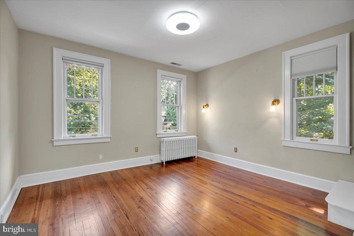 2 Evergreen Lane Haddonfield, NJ 08033 - Photo 21 of 25 a view of empty room with wooden floor and fan