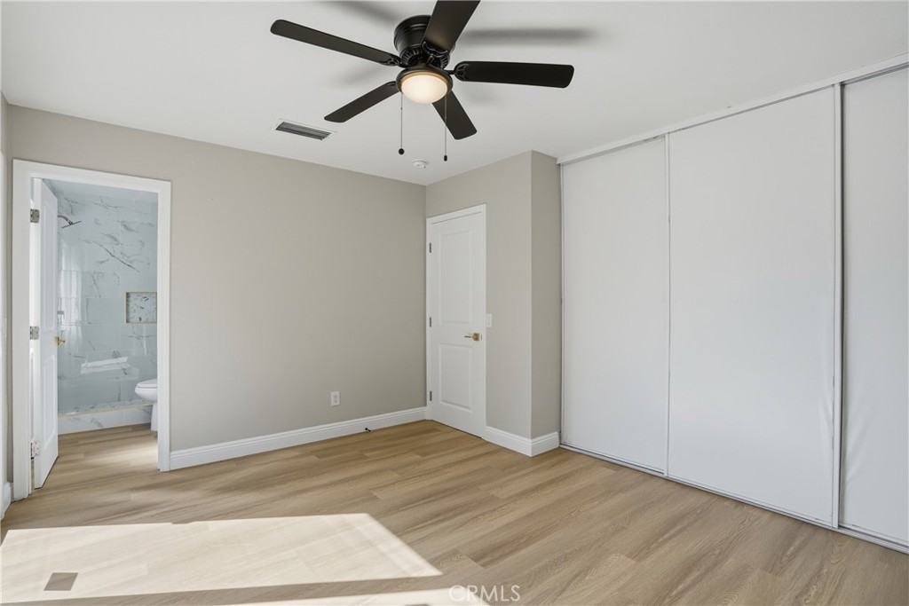 2924 Louisiana Place Riverside, CA 92506 - Photo 34 of 42 a view of a big room with wooden floor and a bathroom