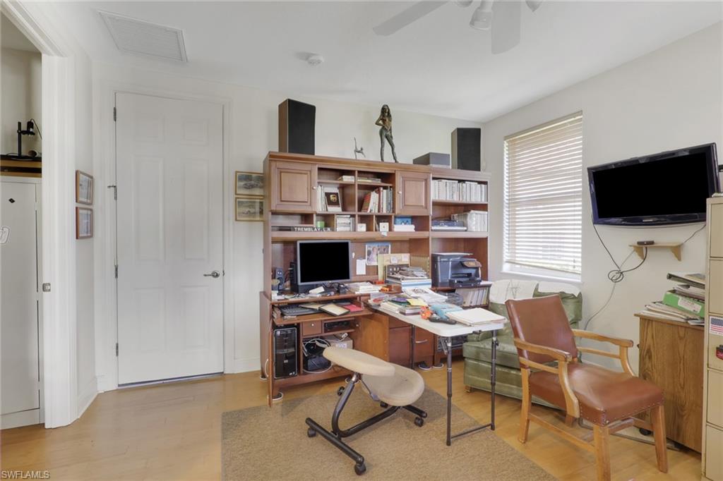 435 Terracina Way Naples, FL 34119 - Photo 27 of 50 Home office with light wood-style floors and ceiling fan