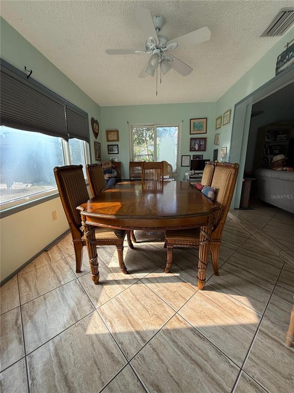 11308 Libby Road Spring Hill, FL 34609 - Photo 13 of 14 a view of a dining room with furniture