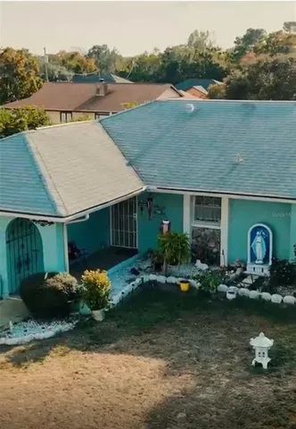 a front view of house with outdoor space and lake view