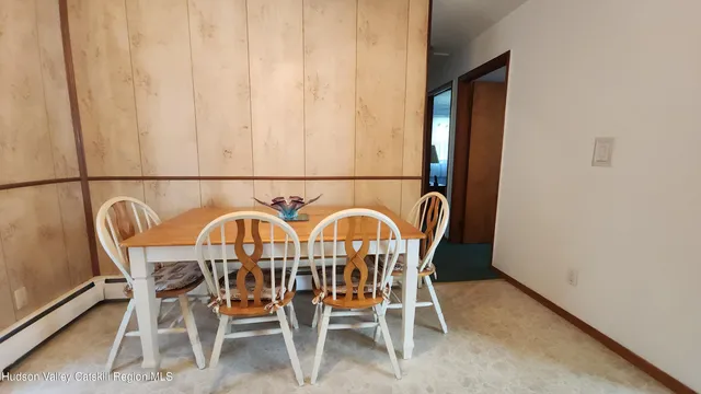 a view of a dining room that has a table and chair