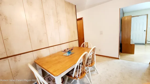 a room with table and chairs
