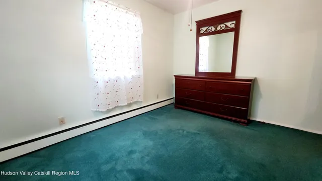 a room with a bed and a window