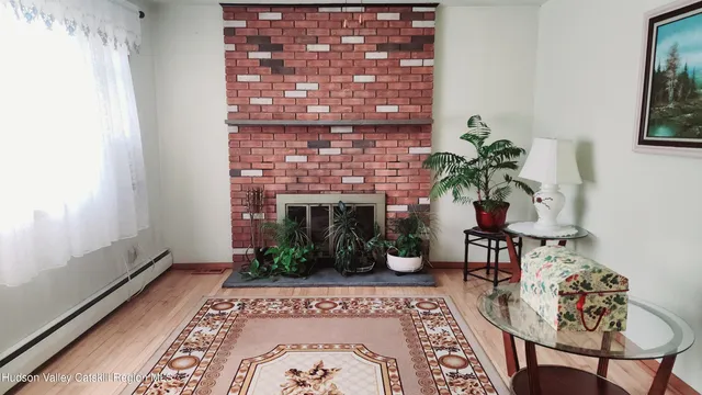 a living room with furniture and a fireplace