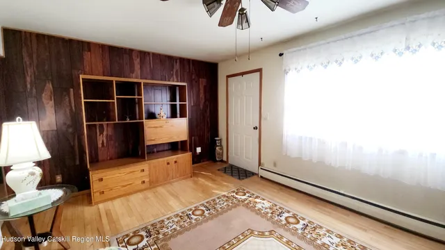 a bedroom with furniture and window