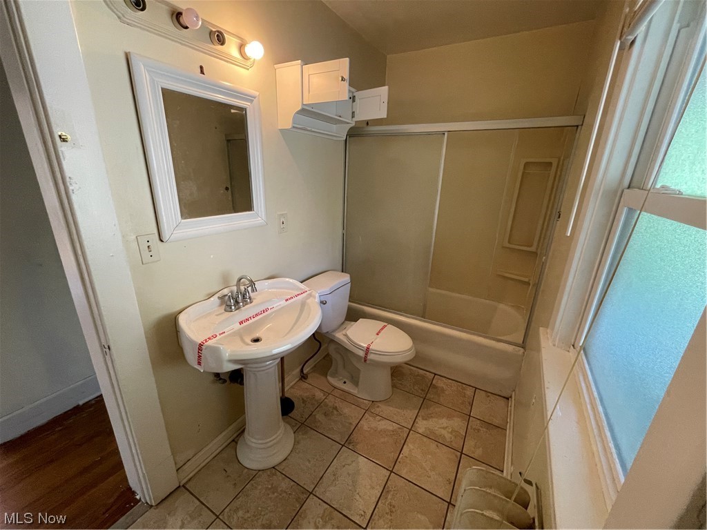 1730 Wood Road Cleveland Heights, OH 44121 - Photo 21 of 34 Full bathroom with mirror, shower / bathtub combination, sink, and light tile floors