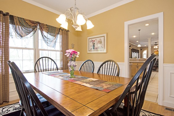 554 Douglas Road Northbridge, MA 01588 - Photo 13 of 30 a view of a dining room with furniture a chandelier and wooden floor