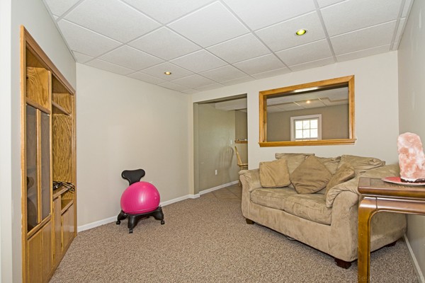 554 Douglas Road Northbridge, MA 01588 - Photo 29 of 30 a living room with furniture a table and a chandelier