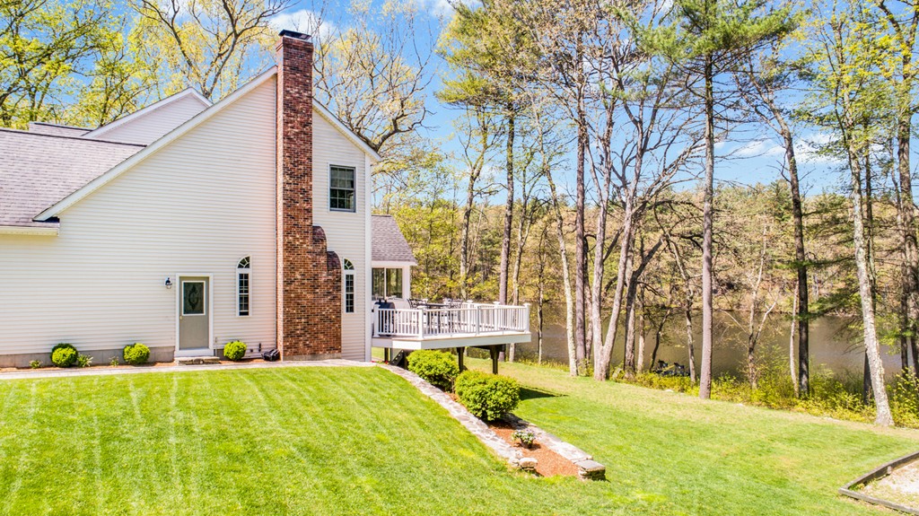 554 Douglas Road Northbridge, MA 01588 - Photo 6 of 30 a front view of a house with a yard and trees