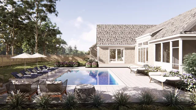 a view of a house with backyard and sitting area