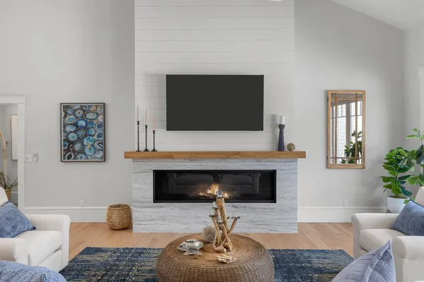 a living room with furniture and a fireplace