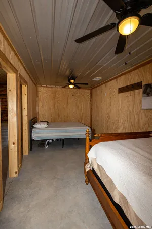 a bedroom with bed and window