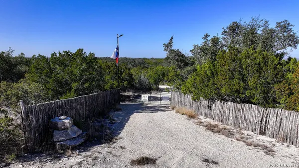 a view of a patio with wooden fence