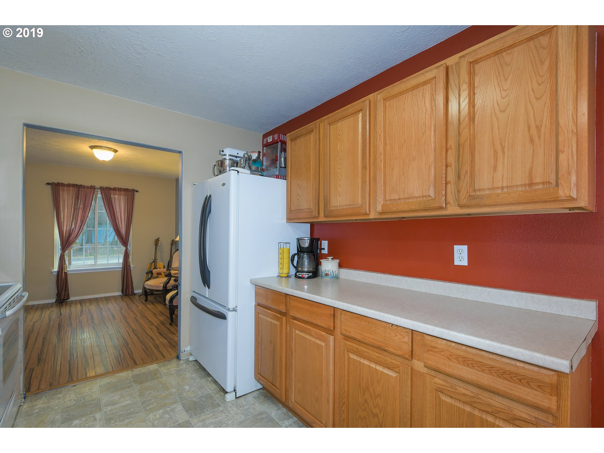 65210 East Alpine Way Rhododendron, OR 97049 - Photo 11 of 29 a kitchen with a refrigerator and cabinets