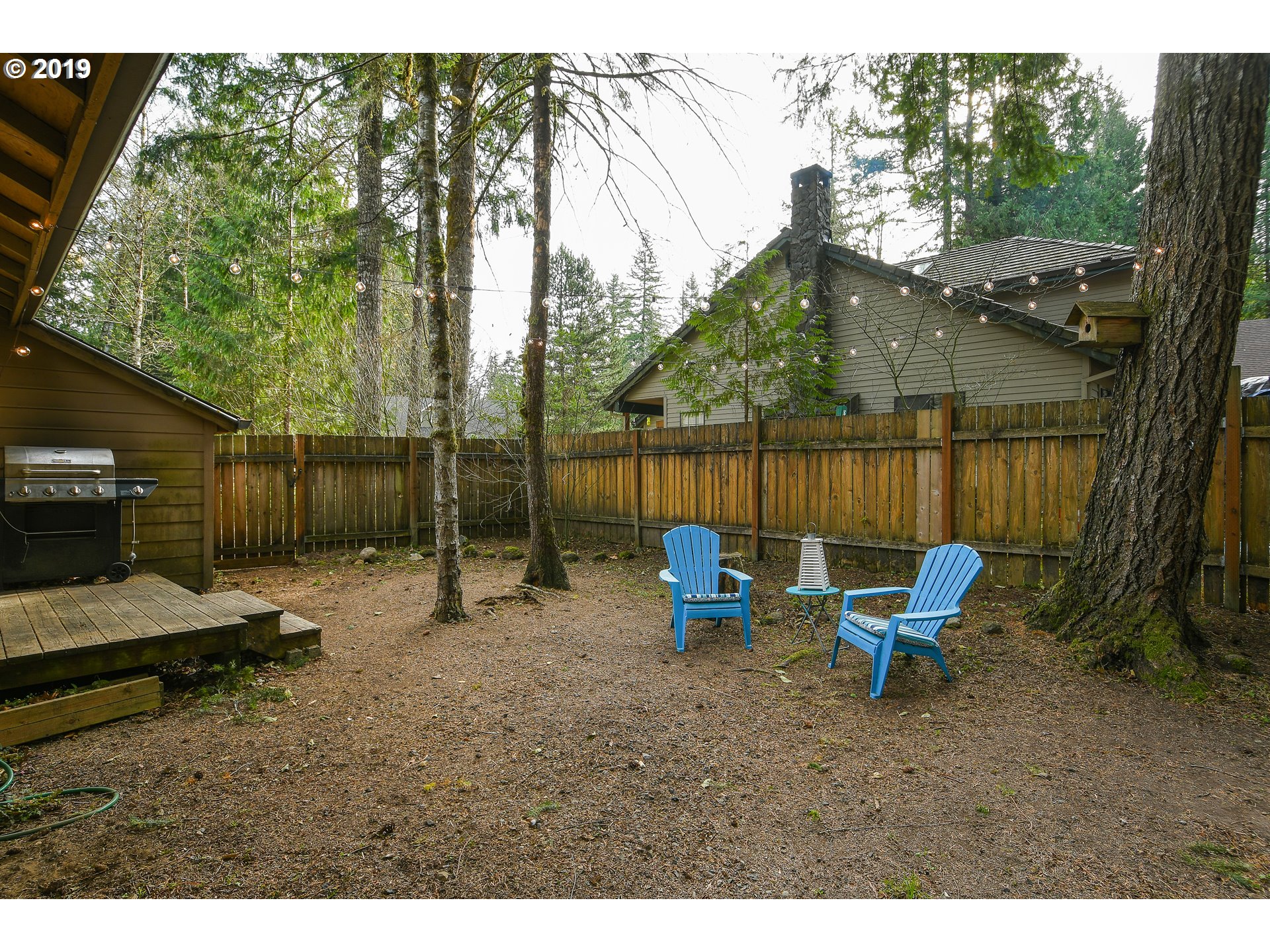 65210 East Alpine Way Rhododendron, OR 97049 - Photo 21 of 29 a backyard of a house with barbeque oven table and chairs