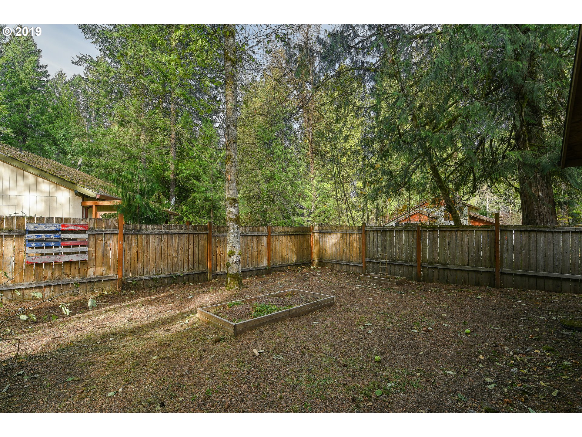 65210 East Alpine Way Rhododendron, OR 97049 - Photo 23 of 29 a view of a backyard with wooden fence